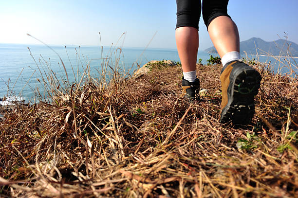 istock hiking feet seaside mountain peak 460357489
