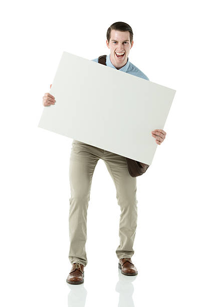 istock Smiling young businessman holding a placard 460360023