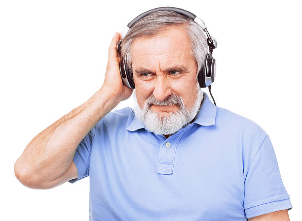 istock Happy old guy listening to music 460361329