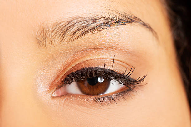 istock Female woman's face. Close up on eye. 460382217