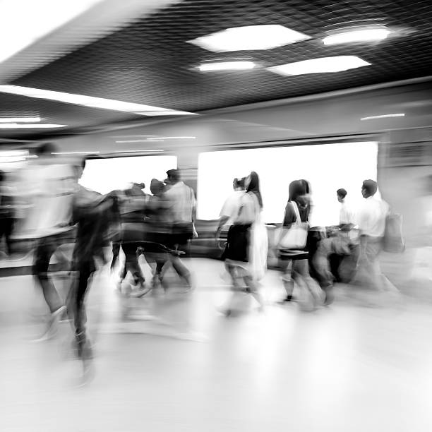 istock black and white blur passenger walk at subway station 460386397