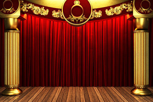 istock red fabric curtain on golden stage 460390133