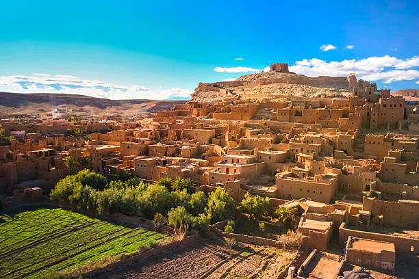Ait Benhaddou, Ouarzazate, Morocco. Ait Benhaddou is a fortified city, or ksar, along the former caravan route between the Sahara and Marrakech in present day Morocco. It is situated in Souss Massa Draa on a hill along the Ounila River and is known for its kasbah. marrakesh photos stock pictures, royalty-free photos & images