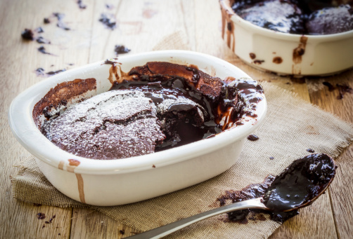 A rustic image of a self saucing chocolate pudding just come out the oven