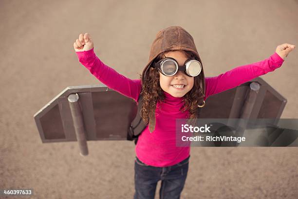 Young Girl In Pilot Gear With Toy Aircraft Wings Stock Photo - Download Image Now - Child, Girls, Aircraft Wing