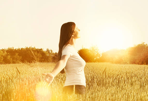 istock Young woman enjoying nature 460401661