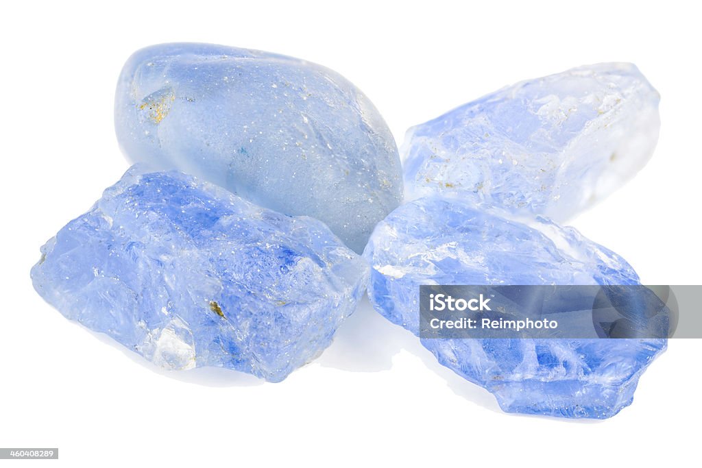 Sapphire Four blue sapphires in a pile. Raw and uncut. Aluminum Stock Photo