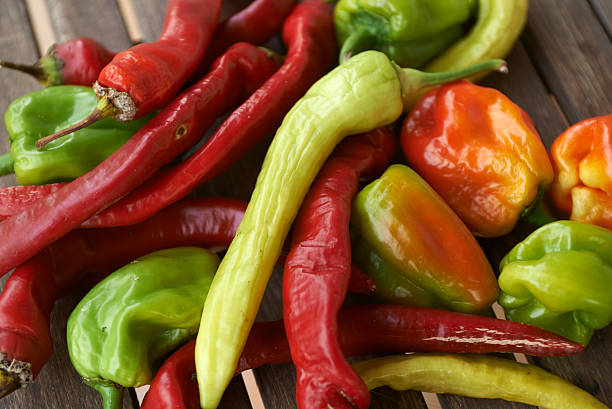 istock red hot chili peppers on wooden table 460408535