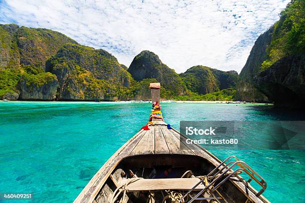 Wooden Boat In Crystal Water On Phi Island Thailand Stock Photo - Download Image Now