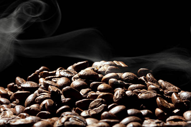 istock Roasted coffee beans on dark background 460409315