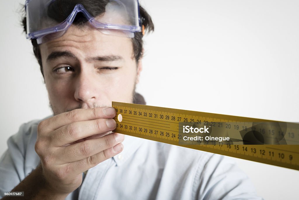young man bricolage working measuring with meter young man bricolage working measuring with meter at home Adult Stock Photo