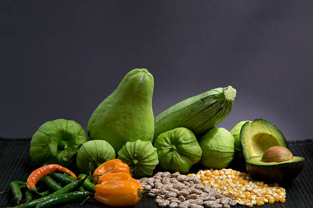 Different vegetables on a dark grey background stock photo