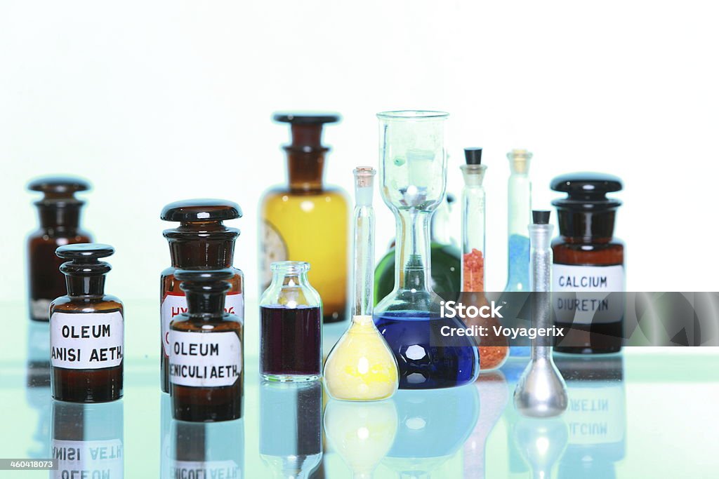 Various pharmacy medicine bottles isolated Various medicine glass bottles as pharmacy equipment, apothecary pots with ingredients for medicins isolated on white background Alchemy Stock Photo