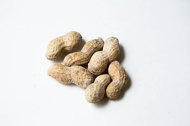 Group of peanuts on white background stock photo