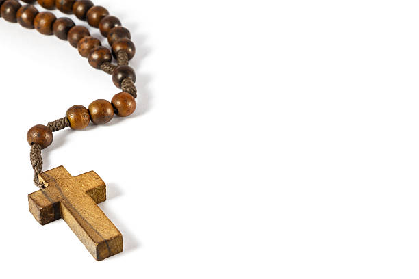 istock wood rosary with cross at left border 460421775