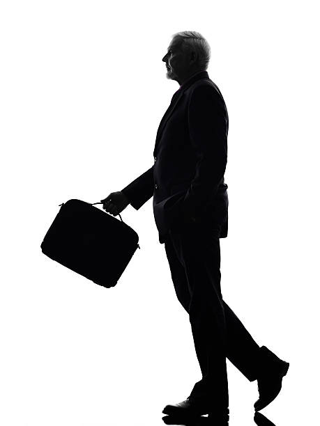 istock senior business man walking silhouette 460427855