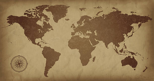 A sepia colored vintage world map, with a compass detail  A world map on aged paper. Files included – jpg, ai (version 8 and CS3), svg, and eps (version 8)	 vintage maps stock illustrations