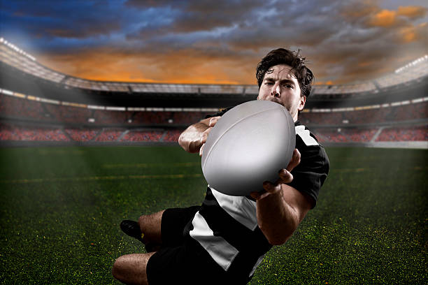 istock Frontal view of a rugby player catching the ball 460448273