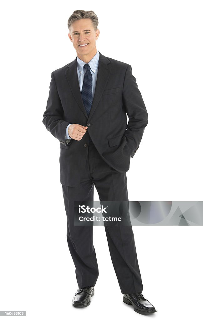 Portrait Of Confident Mature Businessman In Formals Full length portrait of confident mature businessman in formals standing isolated over white background Businessman Stock Photo