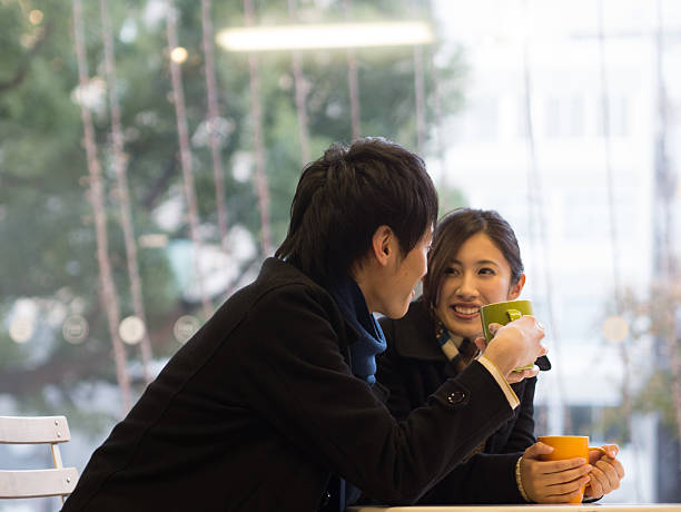 istock Young couple taking at a cafe 460454507
