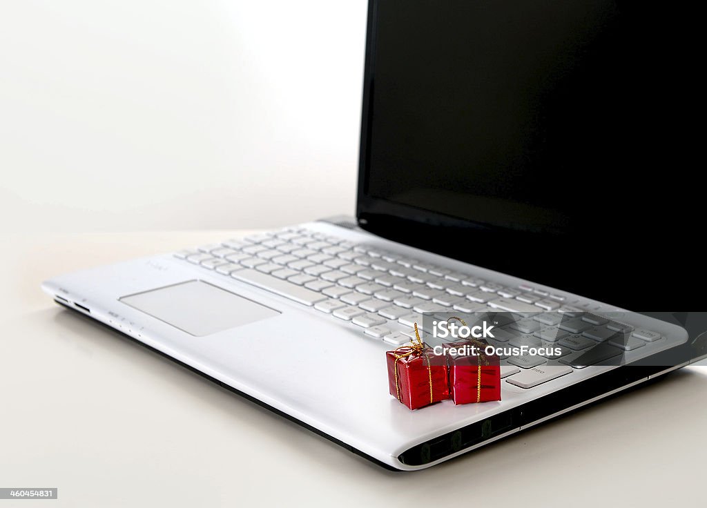 Christmas Presents on Computer Keyboard Christmas Presents on Computer Keyboard representing online shopping Box - Container Stock Photo