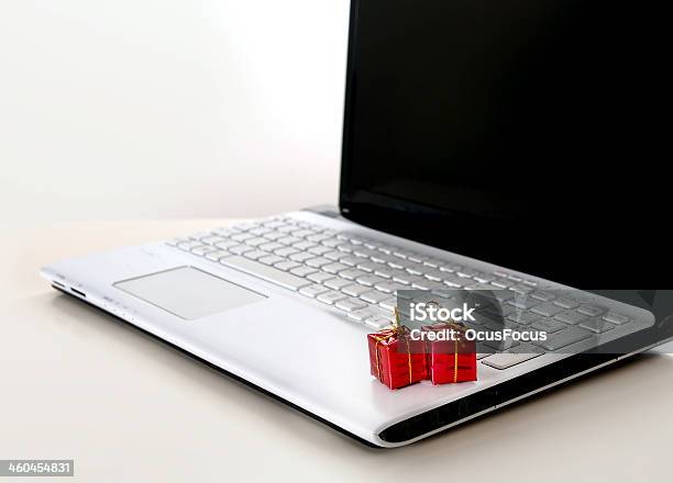 Christmas Presents On Computer Keyboard Stock Photo - Download Image Now - Box - Container, Business, Buying