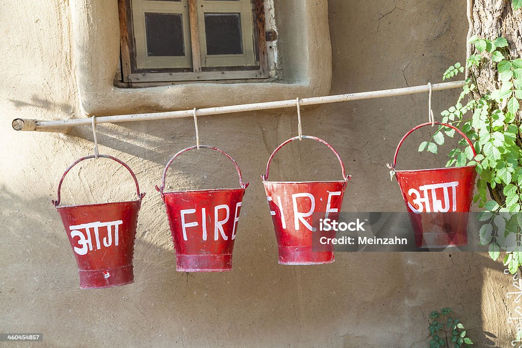 red fire buckets filled with sand red fire buckets filled with sand  to protect in case of fire Asia Stock Photo