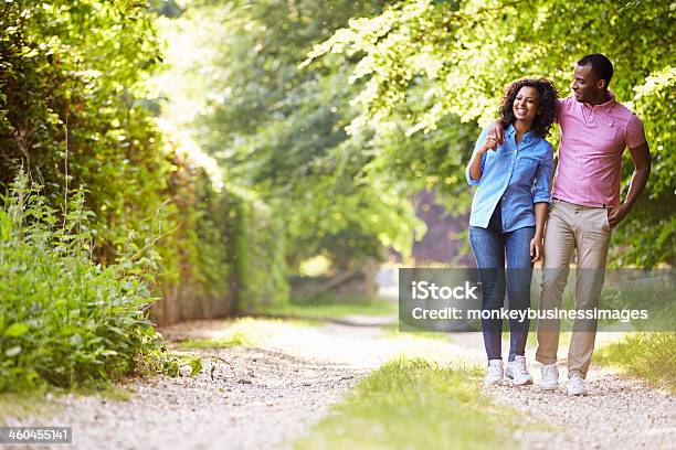 A Couple Walking In The Countryside Stock Photo - Download Image Now - African-American Ethnicity, Vitality, 20-29 Years