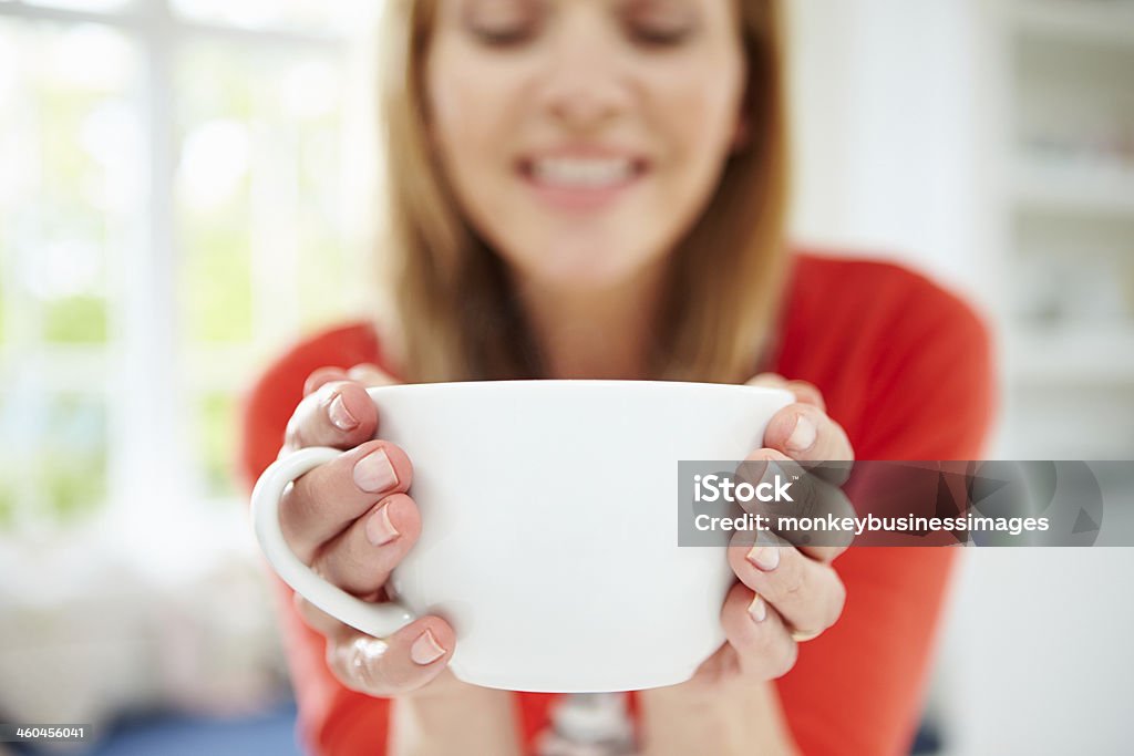 Woman Relaxing At Home With Hot Drink Close Up Of Woman Relaxing At Home With Hot Drink 40-49 Years Stock Photo
