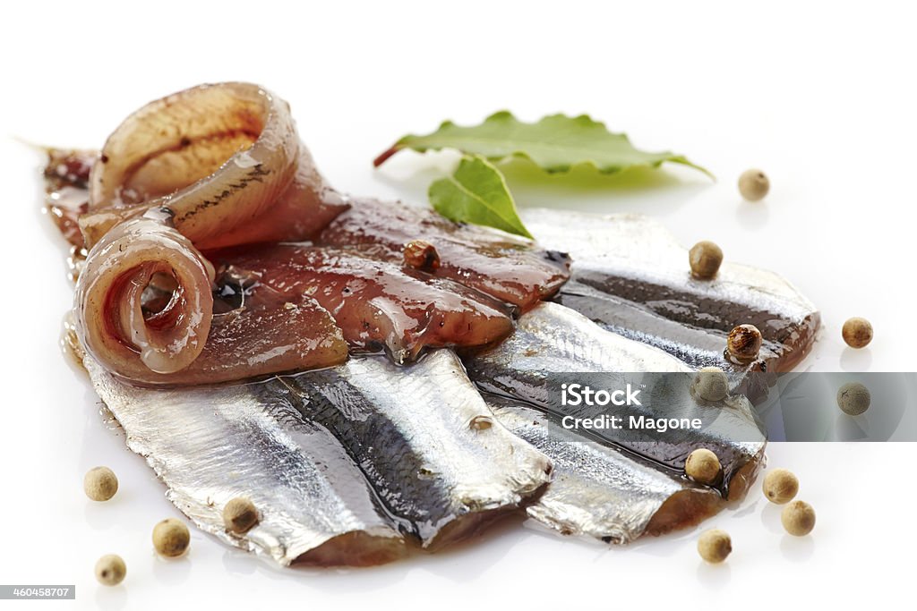 salted anchovies salted anchovies on a white background Anchovy Stock Photo