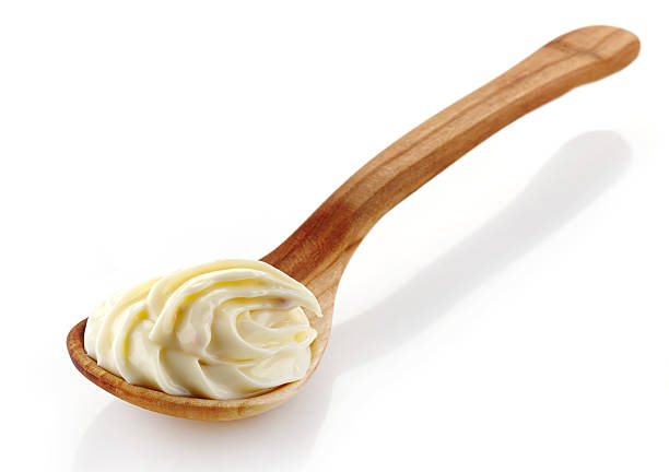 istock wooden spoon with cream cheese 460475509