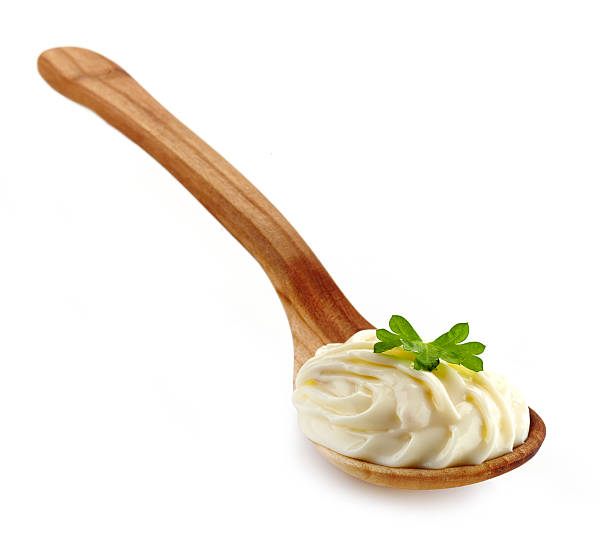 istock wooden spoon with cream cheese 460475559