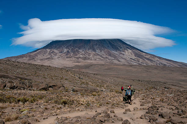 A group of porters passing through The saddle area on Rongai Route, Kilimanjaro