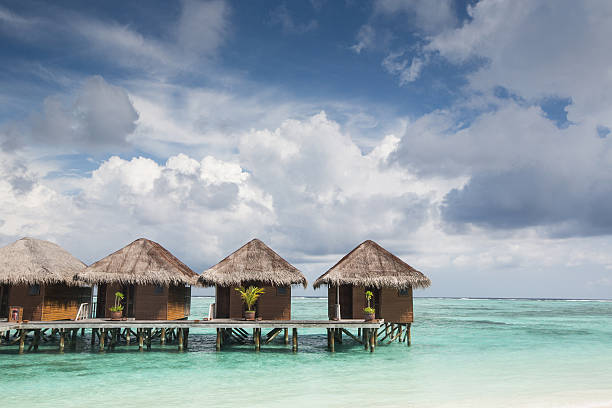 istock Small wooden houses on sea 460491773