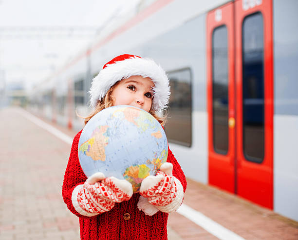 istock Little girl Santa travelling 460495893