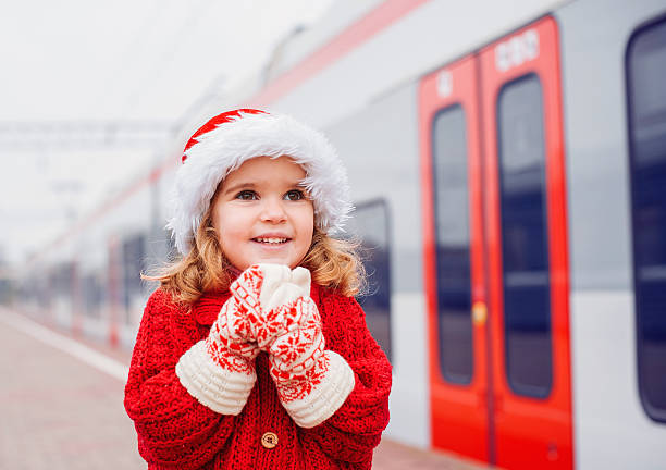 Little Santa travelling Little Santa waiting for a train railroad station platform photos stock pictures, royalty-free photos & images