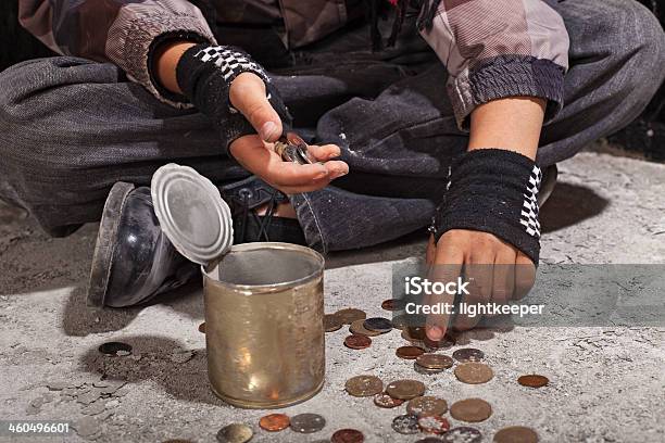 Beggar Child Counting Coins Sitting On Damaged Concrete Floor Stock Photo - Download Image Now