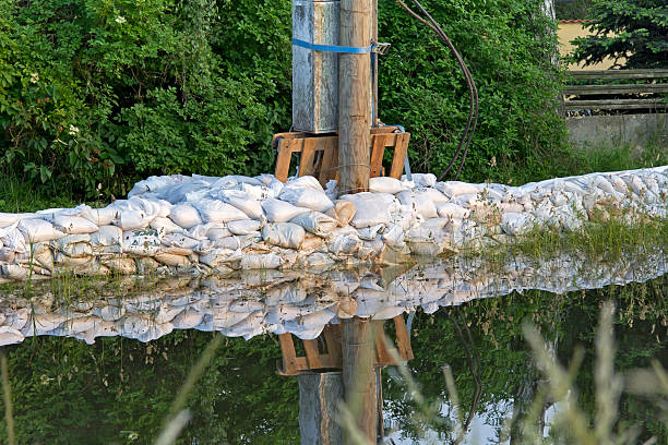 Serbia, Sremska Mitrovica - May 17 2014: The army, police and citizens together raise the walls banks with sandbags.The water level of Sava River remains high in worst flooding on record across the Balkans on may 17, 2014