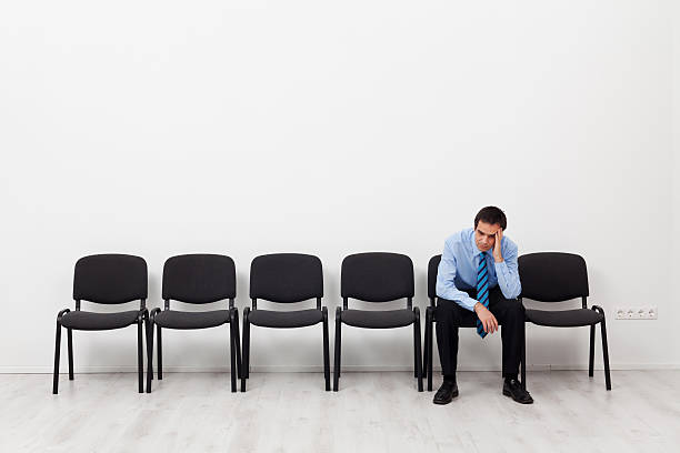 istock Desperate businessman or employee sitting alone 460506975