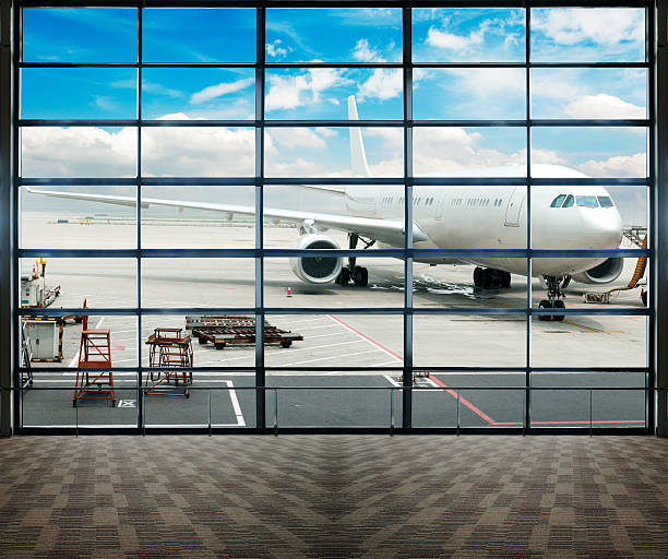 istock Parked aircraft on shanghai airport through the gate window. 460514541