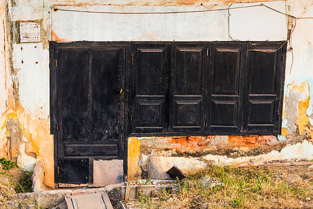 wooden door and windows, colonial old building style at  Vientia stock photo