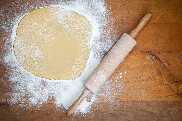 istock Cookie Dough on wooden Table with Rolling Pin 460519605