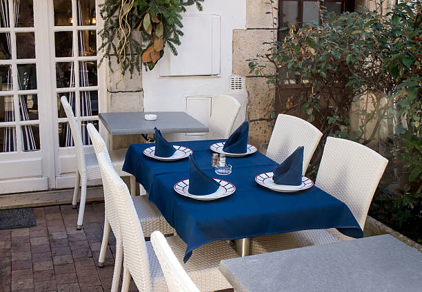 istock Table set with blue tablecloth and napkins 460519777