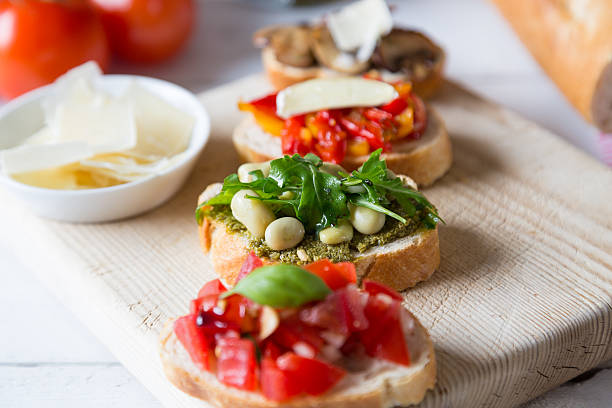 istock Bruschetta with beans and arugula, mushrooms, goat cheese 460528641