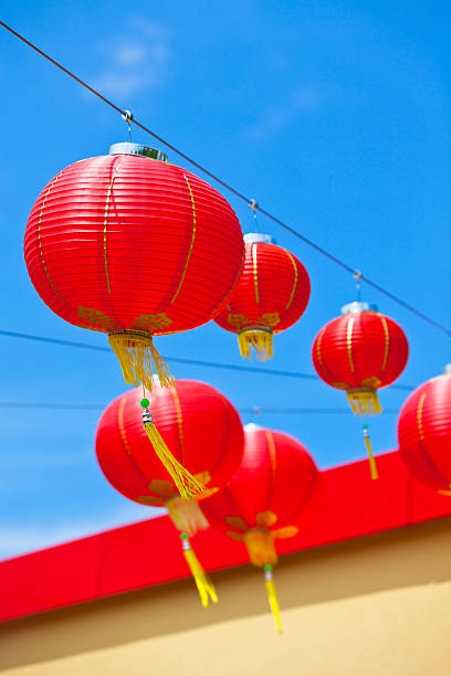 istock Red Chinese Paper Lanterns against a Blue Sky 460530449