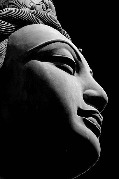 ภาพระยะใกล้ของรูปปั้นหญิงของพระเจ้าพุทธ - buddha face ภาพสต็อก ภาพถ่ายและรูปภาพปลอดค่าลิขสิทธิ์