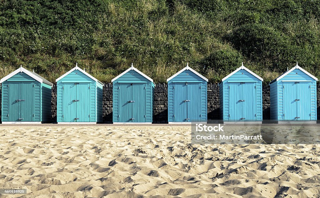Turquoise painted wooden beach huts in Bournemouth Beach huts at Bournemouth, Dorset, UK. Beach Hut Stock Photo