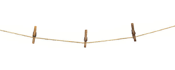 istock clothesline with clothespins isolated on white  background 460539719