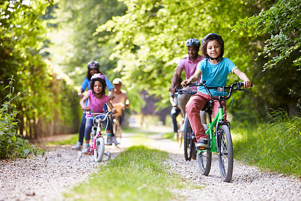 istock A multigeneration family riding on bikes through a forest 460549519