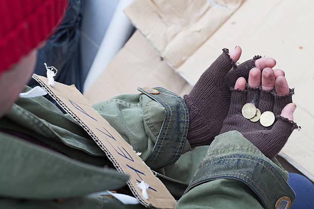 Homless with the alms Hands of homeless person holding a few cents alms stock pictures, royalty-free photos & images